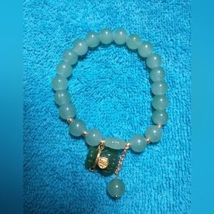 Goldtone green beaded stretch lucky bear faux jade bracelet